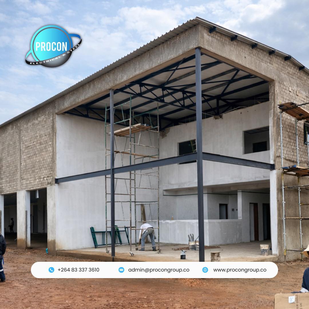 Warehouse under construction with steel beams and roof framework